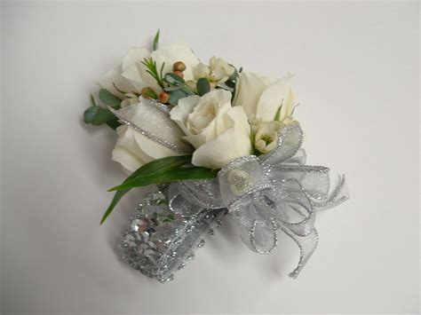 White And Silver Coursage By Corsages Boutonnieres
