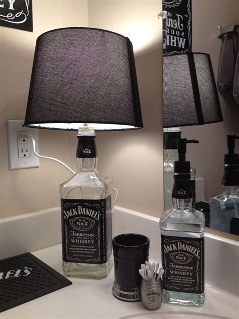 Stadium lighting, large murals and a corner bar complete this winning space. man-cave-bathroom-with-jack-daniels-bottle