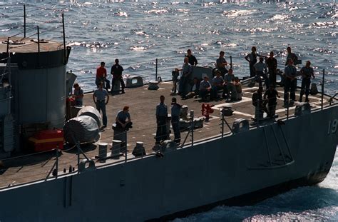 Sailors Relax On The Stern Of The Guided Missile Destroyer Uss Tattnall