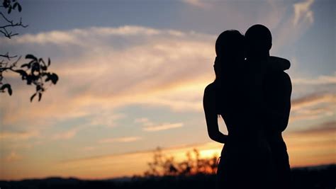 Silhouette Kiss During Beautiful Sunset Medium Shot Stock Footage