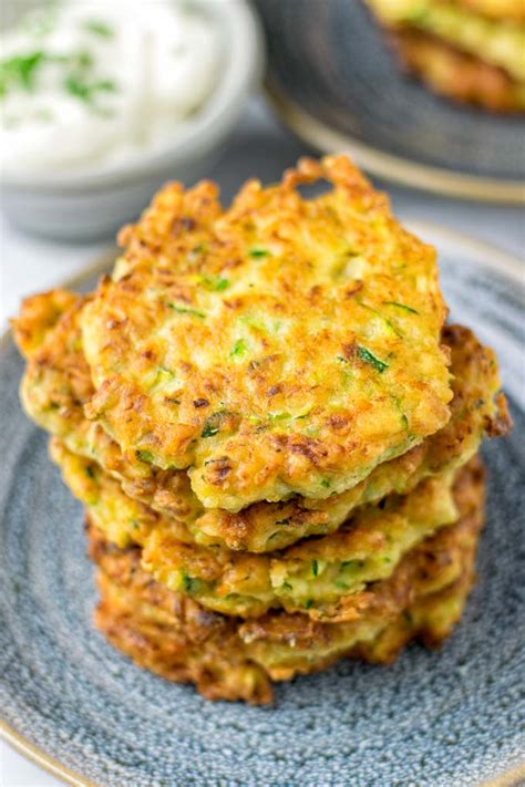 Crispy fried cakes of zucchini, yellow squash, and carrots make a delicious appetizer or side dish. Zucchini Fritters eggless, vegan - Contentedness Cooking
