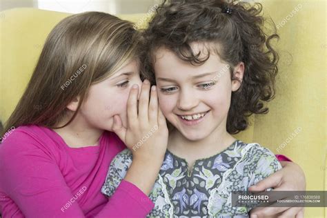 Two cute little girls whispering — relaxation, listening - Stock Photo ...