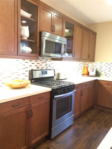 Medium Brown Kitchen Cabinets W Light Quartz Countertop And Mosaic