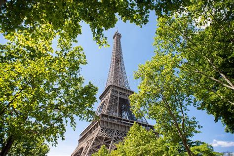 Eiffel Tower In Paris France View Through Green Leaves Stock Image