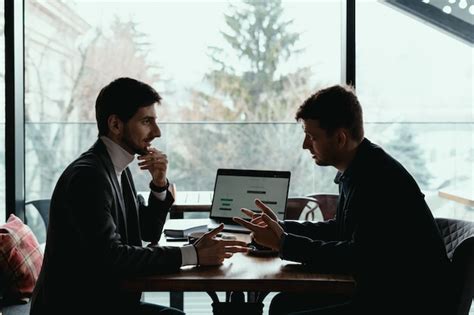 Free Photo Two Young Businessman Having A Successful Meeting At