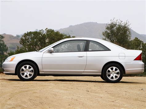For 2003, sedans and coupes come with improved seat fabrics and the outboard rear headrests are now adjustable. Honda Civic Coupe picture # 06 of 21, Side, MY 2003, 1600x1200