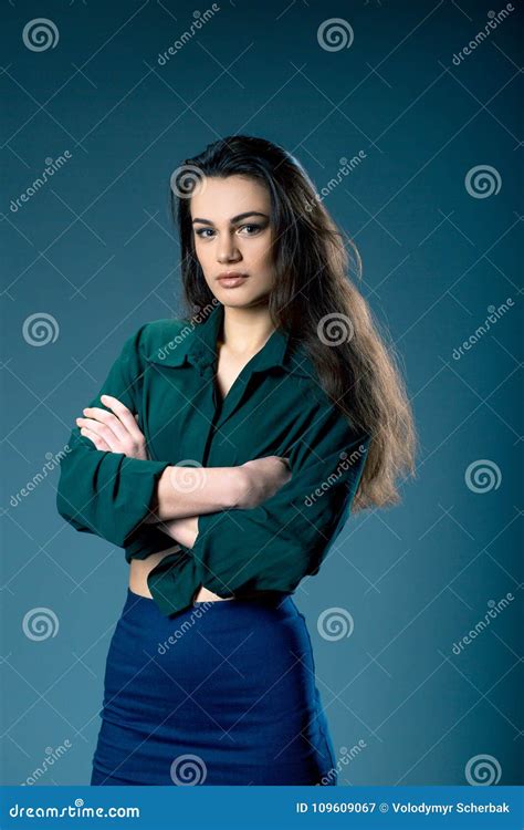 Portrait Of Young Gorgeous Dark Haired Girl With Provocative Make Up Wearing High Waisted Blue