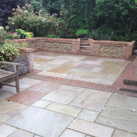 The Sunken Patio With Brick And Flint Panel Walls The Patio Is