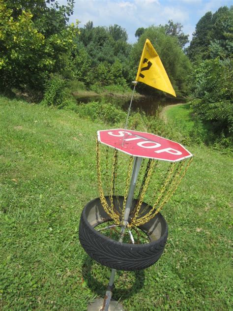 The basic dimensions of a disc golf basket must meet is the ring must be 21 1/3 in diameter and the chains cannot hang more than 22 inches below the rim. Disc Golf Course from Recycled Materials - Trashmagination