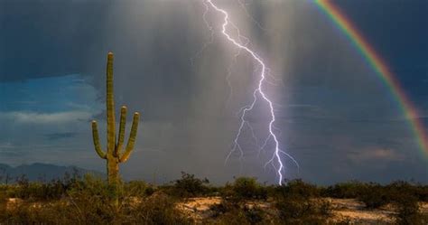 Incredible Moment Lightning Strikes With Rainbow