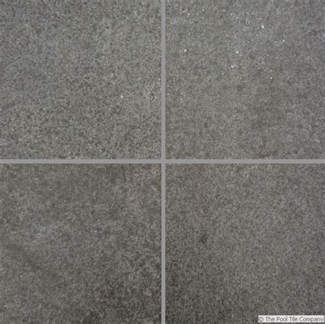 Dark green granite terrazzo flooring texture with square tiles. Black Granite Pool Tiles and Pavers