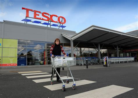Woman Shopper Leaving Tesco Supermarket Ellesmere Editorial Stock Photo