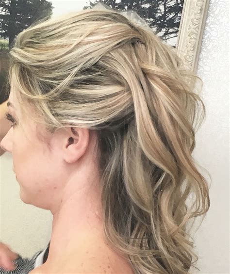 Softly Pinned Back Hair With Loose Curls For A Romantic Wedding Style