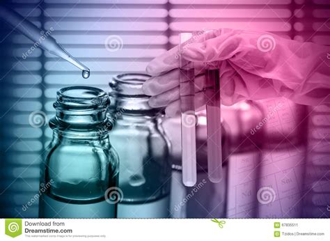 Chemical Laboratoryscientist Dropping The Reagent Into Test Flask