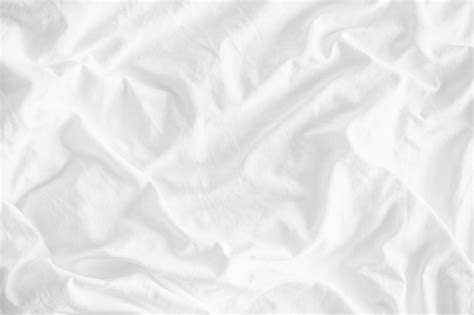 White Wrinkled Fabric Texture Rippled Surface Close Up Unmade Bed