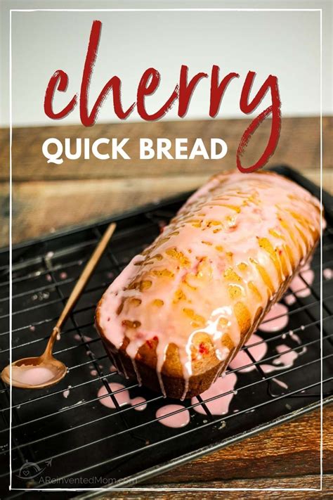 Uncut Loaf Of Glazed Cherry Bread On A Cooling Rack With Graphic