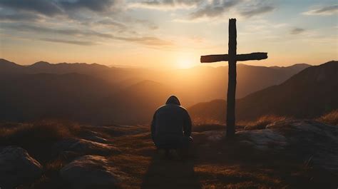 Premium Photo Silhouette Of A Man Kneeling Praying At The Cross Of