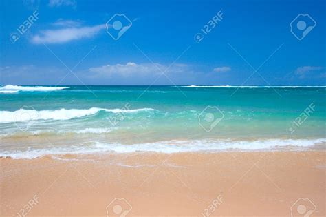 Peaceful Beach Scene With Ocean And Blue Sky Stock Photo Picture