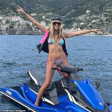 heidi klum 48 shows off her toned frame in a skimpy bikini as she poses on a jet ski in italy
