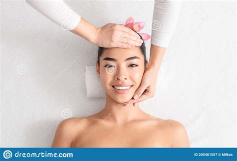 relaxing massage beautiful asian woman enjoying beauty treatments at spa salon stock image
