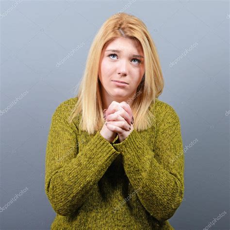 Woman Praying About Something Or Begging For Mercy Against Gray — Stock