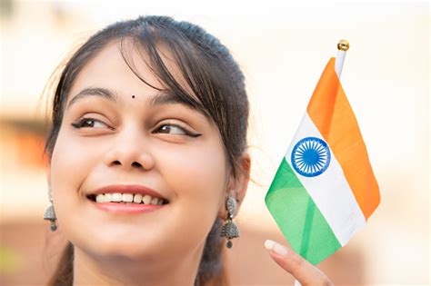Independence Day Portrait Of Beautiful Indian Young Woman Holding