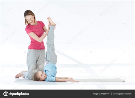 Mother And Daughter Exercising Stock Photo IgorTishenko 143857505