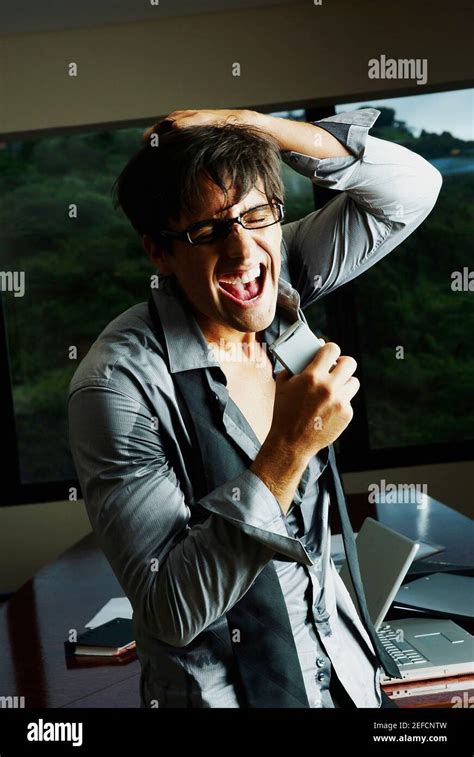 Businessman Pulling His Hair And Screaming Stock Photo Alamy