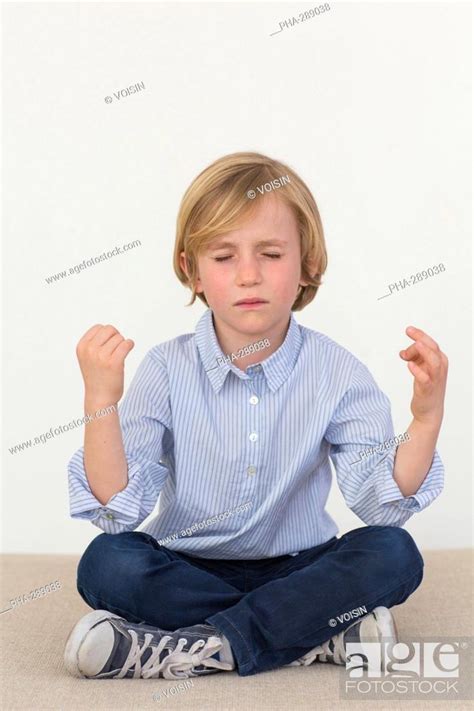 7 Year Old Boy Practice Yoga Stock Photo Picture And Rights Managed