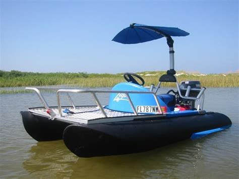 An Inflatable Boat On The Water With An Umbrella Over Its Head