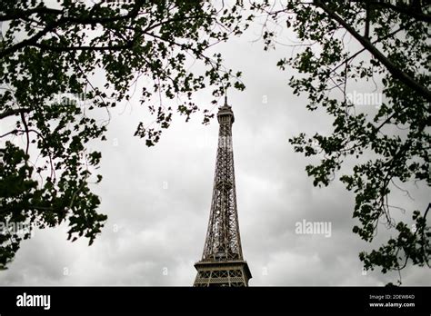 View Of Eiffel Tower Through Trees In Paris Stock Photo Alamy