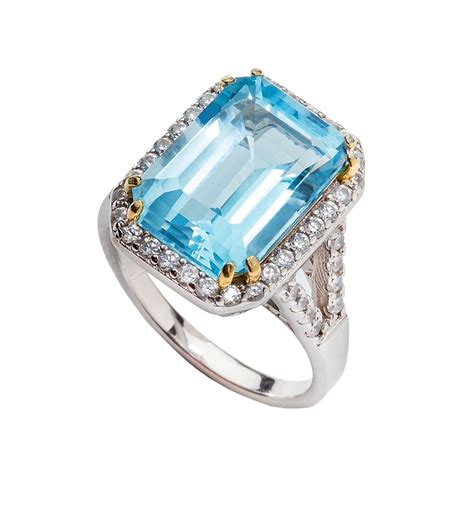 Sterling Silver 8 Carat Blue Topaz Emerald Cut Ring With 18 Kgp Prongs