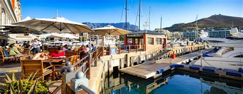 Panoramic View Of Cape Town Marina With Restaurant Pier And Yachts