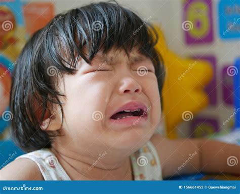 A Crying Little Asian Baby Girl With Tears Stock Photo Image Of Pain