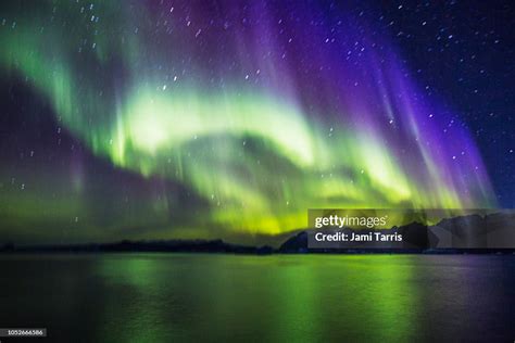 The Bright Colors Of The Aurora Borealis In Scoresby Sound Of East
