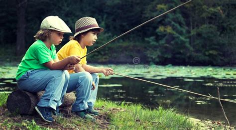 Happy Boys Go Fishing On The River Two Children Of The Fisherman With