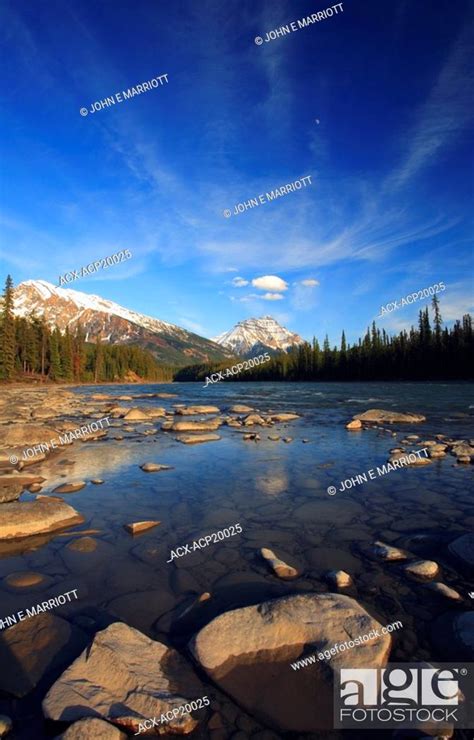 The Athabasca River In Early Spring With Mt Hardisty And Mt Kerkeslin