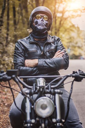 Biker Man Sitting On His Motorcycle Stock Photo Download Image Now