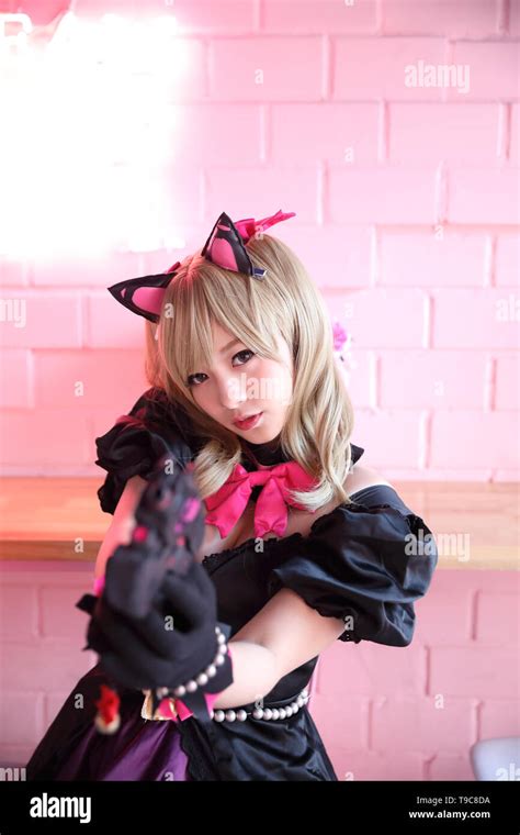 Japan Anime Cosplay Portrait Of Girl Cosplay In Pink Room Background