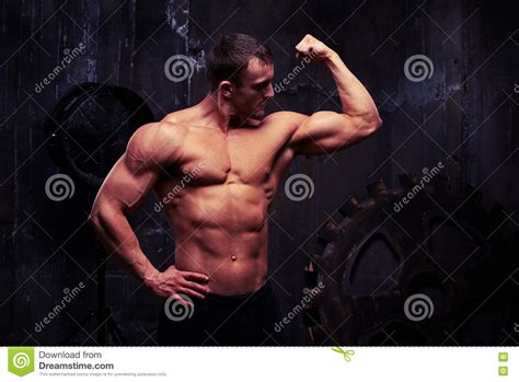 Shirtless Man Flexing Muscles Showing Great Relief Of His
