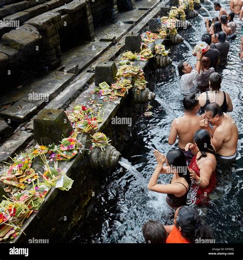 People Making Ritual Purification In The Holy Spring Tirta Empul Temple Tampaksiring Bali
