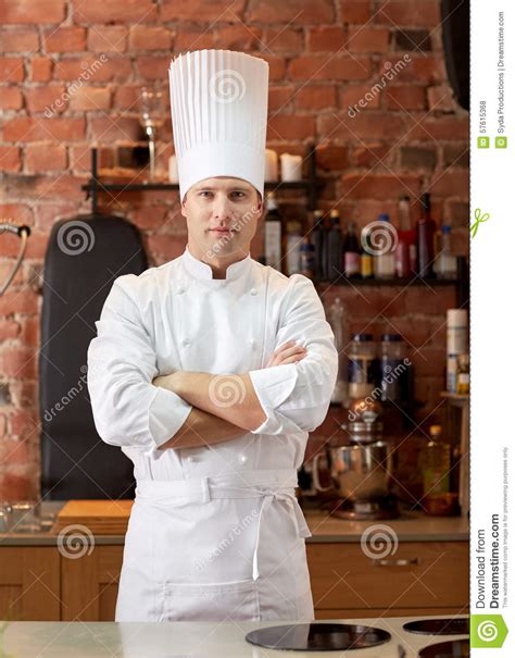 Happy Male Chef Cook In Restaurant Kitchen Stock Photo