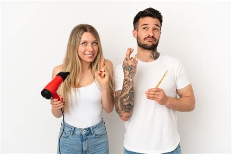 Premium Photo Couple Holding A Hairdryer And Brushing Teeth Over