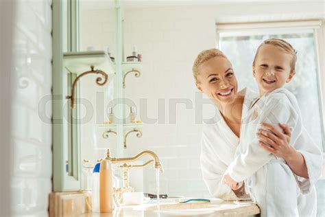 Mother And Son In Bathroom Stock Image Colourbox