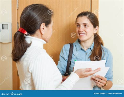 Mature Woman Answer Questions Of Woman With Papers Stock Image Image