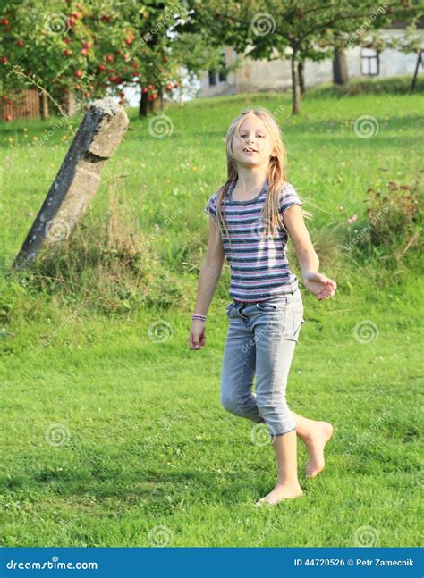 Little Girl Walking Barefoot Stock Photo 44720526
