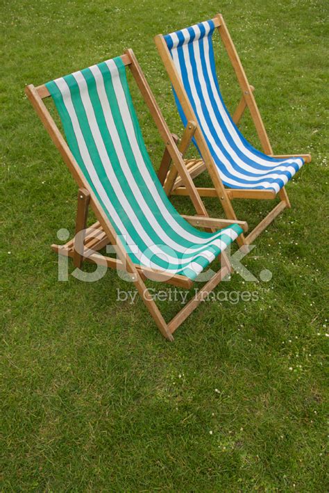 Featured items newest items bestselling alphabetical: Two Striped Deck Chairs on Green Grass Stock Photos ...