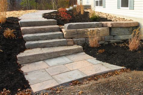 It will look neat and clean to have the driveway go all the way to the retaining wall and stairs. Rosetta walkway, stairs and small retaining wall in New ...