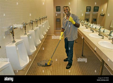 janitor cleaning bathroom