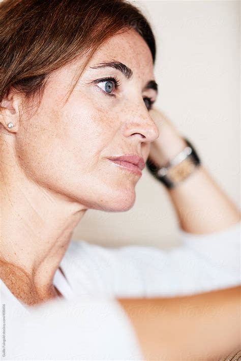 Thoughtful Mature Woman Looking Away By Stocksy Contributor Guille